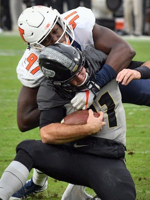 Purdue quarterback David Blough is knocked out of the game on a hit by Illinois' Bobby Roundtree in Purdue's 29-10 win in West Lafayette on Saturday, November 4, 2017.