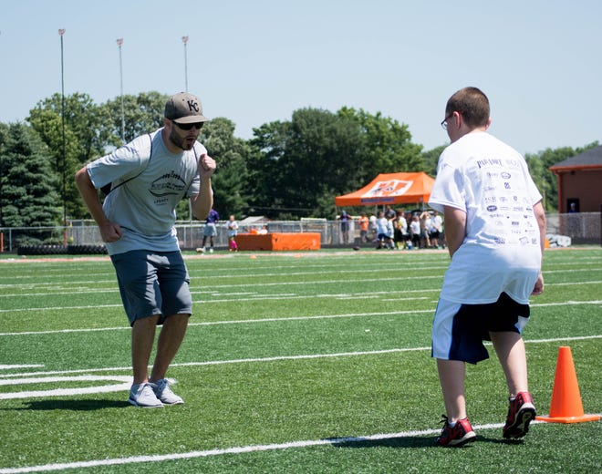 Nicholas Bell of Omaha, Nebraska demonstrates how to properly back off while in coverage on defense. Bell suffers from Cystic Fibrosis and reached out to Washington native Colton Underwood to participate in the camp.