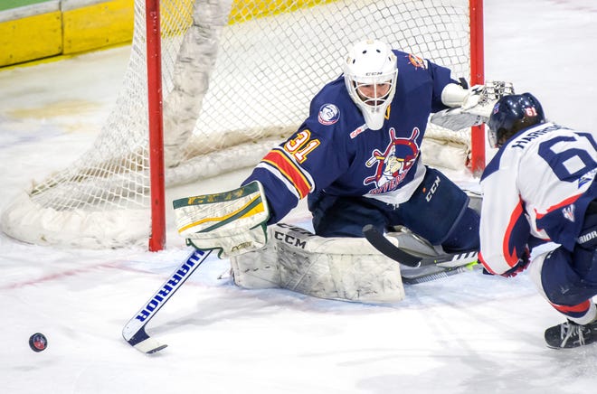 Peoria goaltender Nick Latinovich pokes the puck away from Evansville's Brendan Harrogate in the third period of Game 2 of the SPHL President's Cup semifinals Friday, April 19, 2024 at the Peoria Civic Center. The Rivermen advanced to the finals with a 5-2 victory.