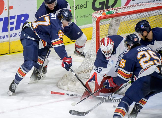 Peoria's Mike Gelatt (27) tries to force the puck past Evansville goaltender Cole Ceci in the second period of Game 2 of the SPHL President's Cup semifinals Friday, April 19, 2024 at the Peoria Civic Center. The Rivermen advanced to the finals with a 5-2 win.