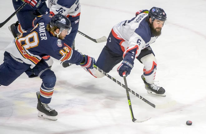 Peoria's Braydon Barker, left, moves the puck past Evansville's Chays Ruddy in the third period of Game 2 of the SPHL President's Cup semifinals Friday, April 19, 2024 at the Peoria Civic Center. The Rivermen advanced to the finals with a 5-2 victory.