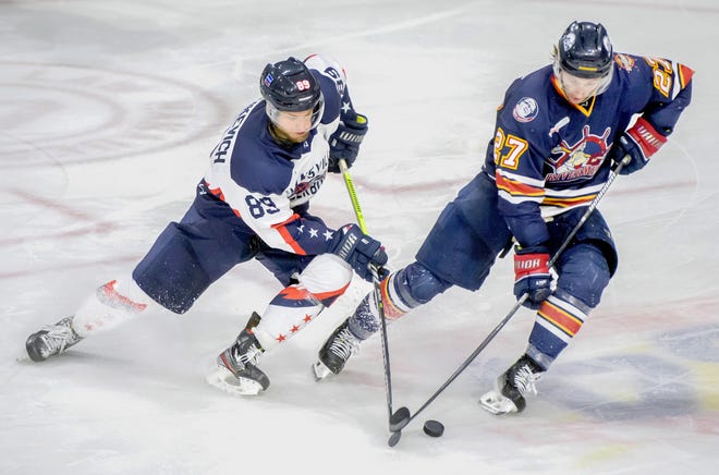 Peoria's Mike Gelatt (27) and Evansville's Dmitry Yushkevich tangle over the puck in the third period theGame 2 of the SPHL President's Cup semifinals Friday, April 19, 2024 at the Peoria Civic Center. The Rivermen advanced to the finals with a 5-2 win.