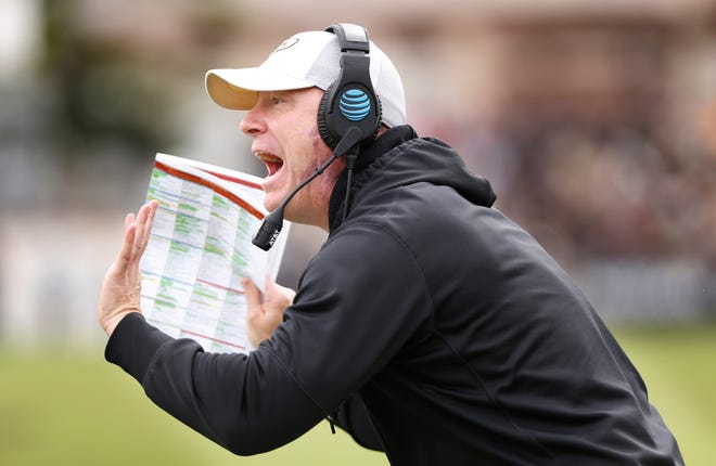 Purdue head coach Jeff Brohm screams to get the attention of the officials after a penalty was whistled against Boston College in the first half Saturday, September 22, 2018, in Ross-Ade Stadium.
