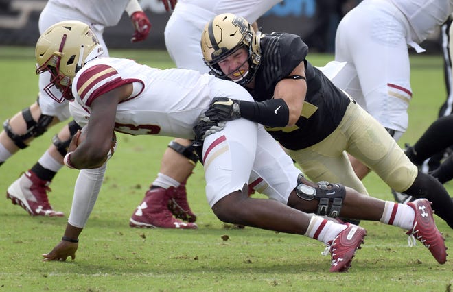 Purdue's Jacob Thieneman sacks BC quarterback Anthony Brown in Purdue's 30-13 win in West Lafayette on Saturday September 22, 2018.