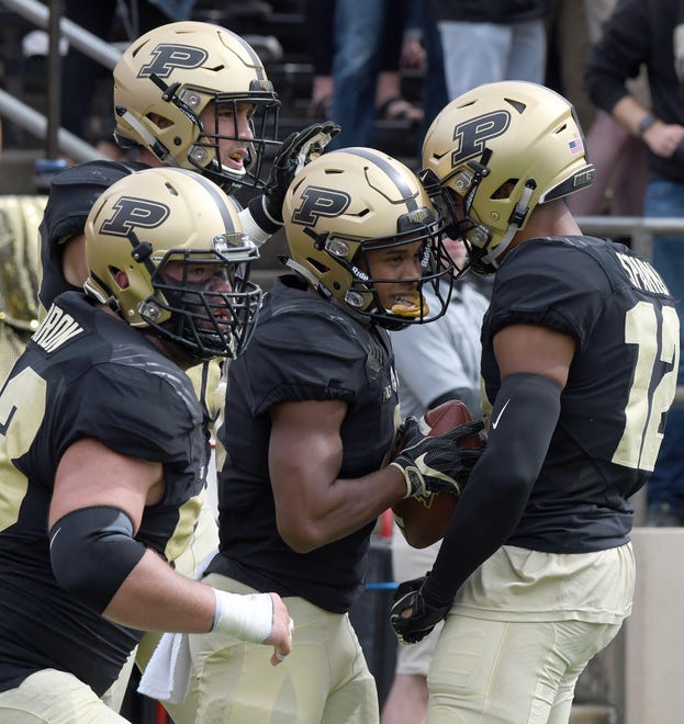Purdue's Rondale Moore is congratulated after scoring a touchdown in Purdue's 30-13 win in West Lafayette on Saturday September 22, 2018.
