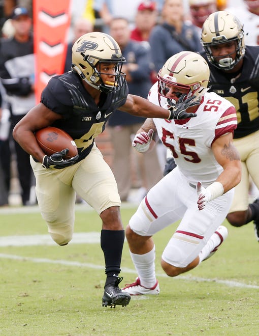 Rondale Moore of Purdue with a stiff arm to Isaiah McDuffie of Boston College on a kick return in the first half Saturday, September 22, 2018, in Ross-Ade Stadium.