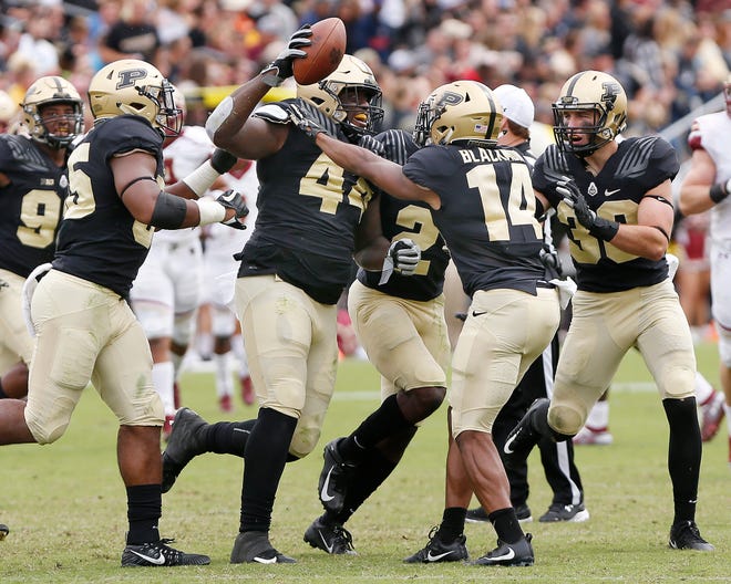 Anthony Watts of Purdue celebrates with teammates after intercepting a Boston College pass that had initially been tipped at the line of scrimmage at 5:42 in the third quarter Saturday, September 22, 2018, in Ross-Ade Stadium. Purdue defeated Boston College 30-13.