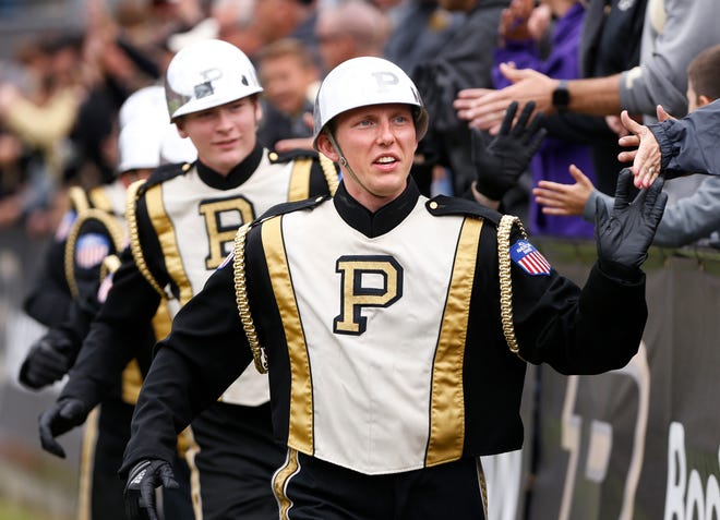 Members of the Drum Crew slap hands with the Purdue faithful as the Boilermakers begin the fourth quarter against Boston College Saturday, September 22, 2018, in Ross-Ade Stadium. Purdue defeated Boston College 30-13.