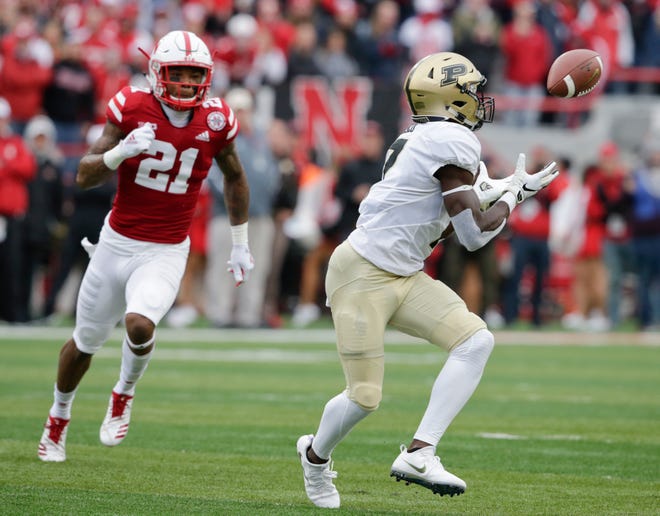Purdue wide receiver Isaac Zico (7) makes a catch in front of Nebraska defensive back Lamar Jackson (21) during the first half of an NCAA college football game in Lincoln, Neb., Saturday, Sept. 29, 2018. (AP Photo/Nati Harnik)
