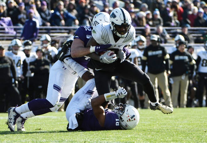 Nov 9, 2019; Evanston, IL, USA; Purdue Boilermakers wide receiver David Bell (3) runs as Northwestern Wildcats linebacker Paddy Fisher (42) tackles him during the first half at Ryan Field. Mandatory Credit: David Banks-USA TODAY Sports