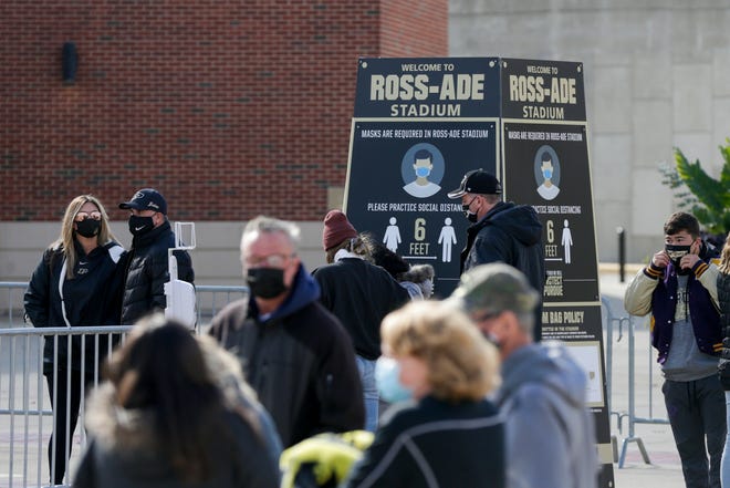 Spectators walk around outside Ross-Ade Stadium before the Purdue Boilermakers take on the Iowa Hawkeyes in the Big10 season opener, Saturday, Oct. 24, 2020 in West Lafayette.