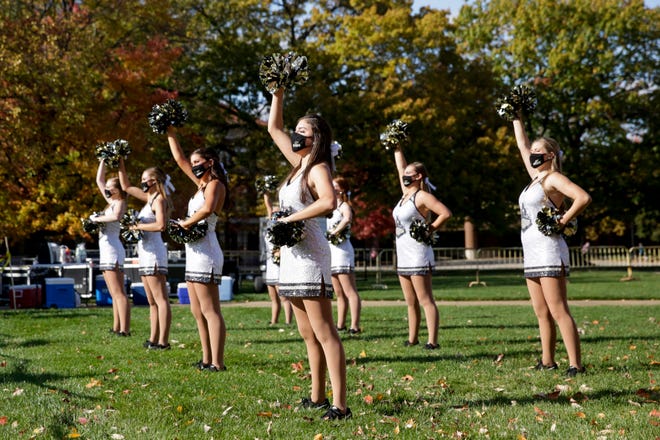 Purdue Cheerleaders perform on the Purdue University Memorial Mall for a watch party for the Boilermakers football game against the Iowa Hawkeyes, Saturday, Oct. 24, 2020 in West Lafayette.
