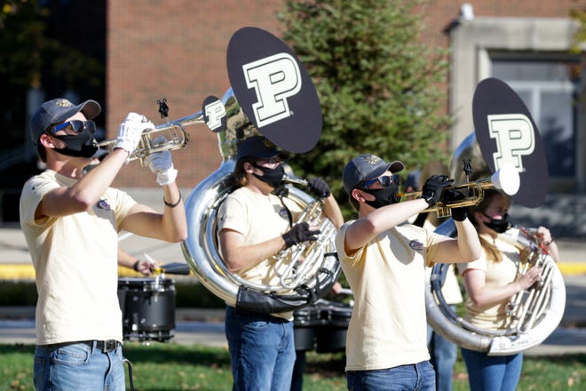 The Purdue Marching Band performs on the Purdue University Memorial Mall for a watch party for the Boilermakers football game against the Iowa Hawkeyes, Saturday, Oct. 24, 2020 in West Lafayette.